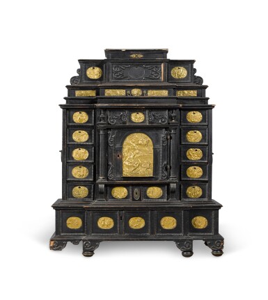 View full screen - View 1 of Lot 86. A South German gilt-metal mounted, ebonised and carved table cabinet, possibly Augsburg, early 17th century.