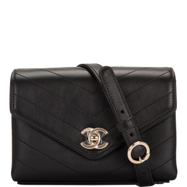 View full screen - View 1 of Lot 95. CHANEL | COCO CHEVRON DOUBLE WRAP WAIST BAG OF BLACK CALFSKIN WITH LIGHT TONE GOLD HARDWARE.