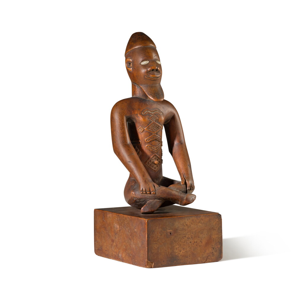 View full screen - View 1 of Lot 59. A Bembe Seated Figure, Democratic Republic of the Congo.