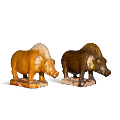 View full screen - View 1 of Lot 22. Two glazed pottery figures of boars, Tang dynasty.