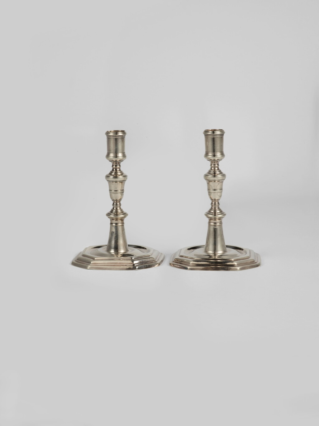 View full screen - View 1 of Lot 523. A Pair of Régence Silver Candlesticks, Jean Beron, Vitre, Circa 1720.