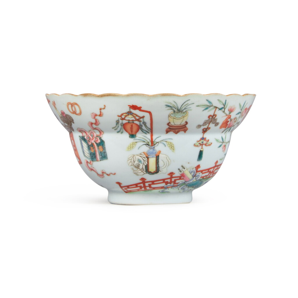 View full screen - View 1 of Lot 28. A famille-rose 'hundred antiques' scallop-rim ogee-form bowl, Seal mark and period of Jiaqing.