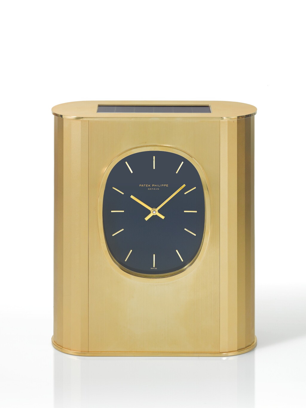 View full screen - View 1 of Lot 91. PATEK PHILIPPE | REF 31477 ELLIPSE D'OR SOLAR, A GILT BRASS SOLAR-POWERED DESK TIMEPIECE MADE IN 1976.