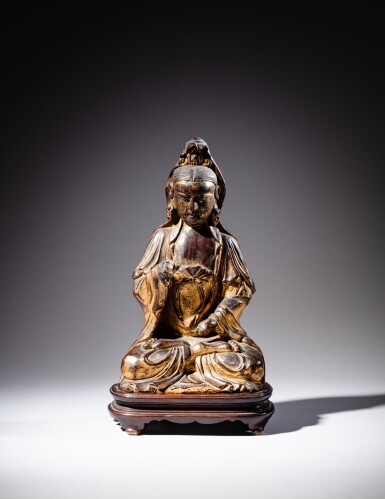 View full screen - View 1 of Lot 105. A gilt-lacquered wood figure of Guanyin, Qing dynasty | 清 漆金木觀音坐像.