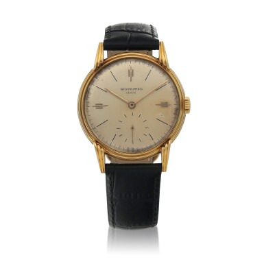View full screen - View 1 of Lot 477. Calatrava Ref. 2405 Yellow gold wristwatch with fluted bands and claw lugs Circa 1945.
