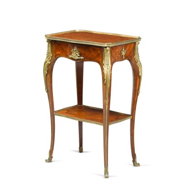 View full screen - View 1 of Lot 595. A French gilt-bronze mounted kingwood, bois satiné and fruitwood marquetry table by Henry Dasson, 1891.