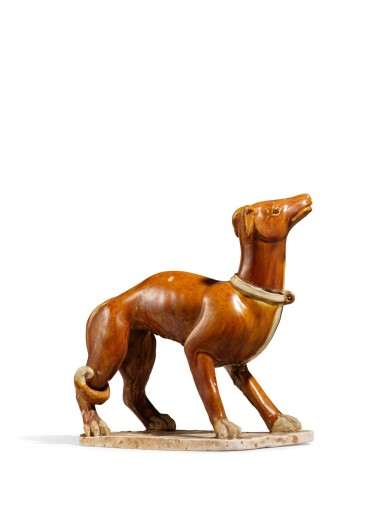 View full screen - View 1 of Lot 2002. A rare amber-glazed figure of a dog, Tang dynasty | 唐 褐釉犬.