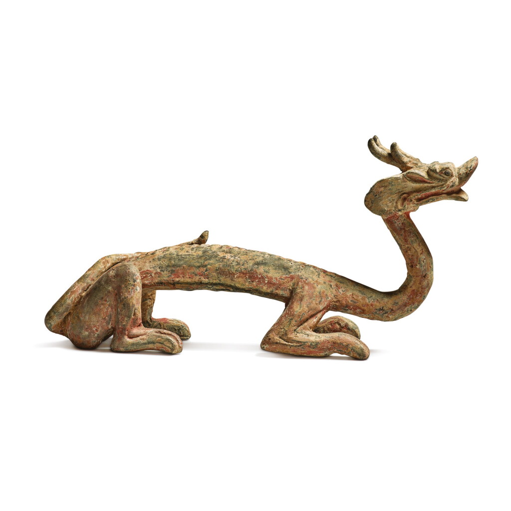 View full screen - View 1 of Lot 687. A RARE PAINTED GRAY POTTERY FIGURE OF A DRAGON, HAN - SIX DYNASTIES.
