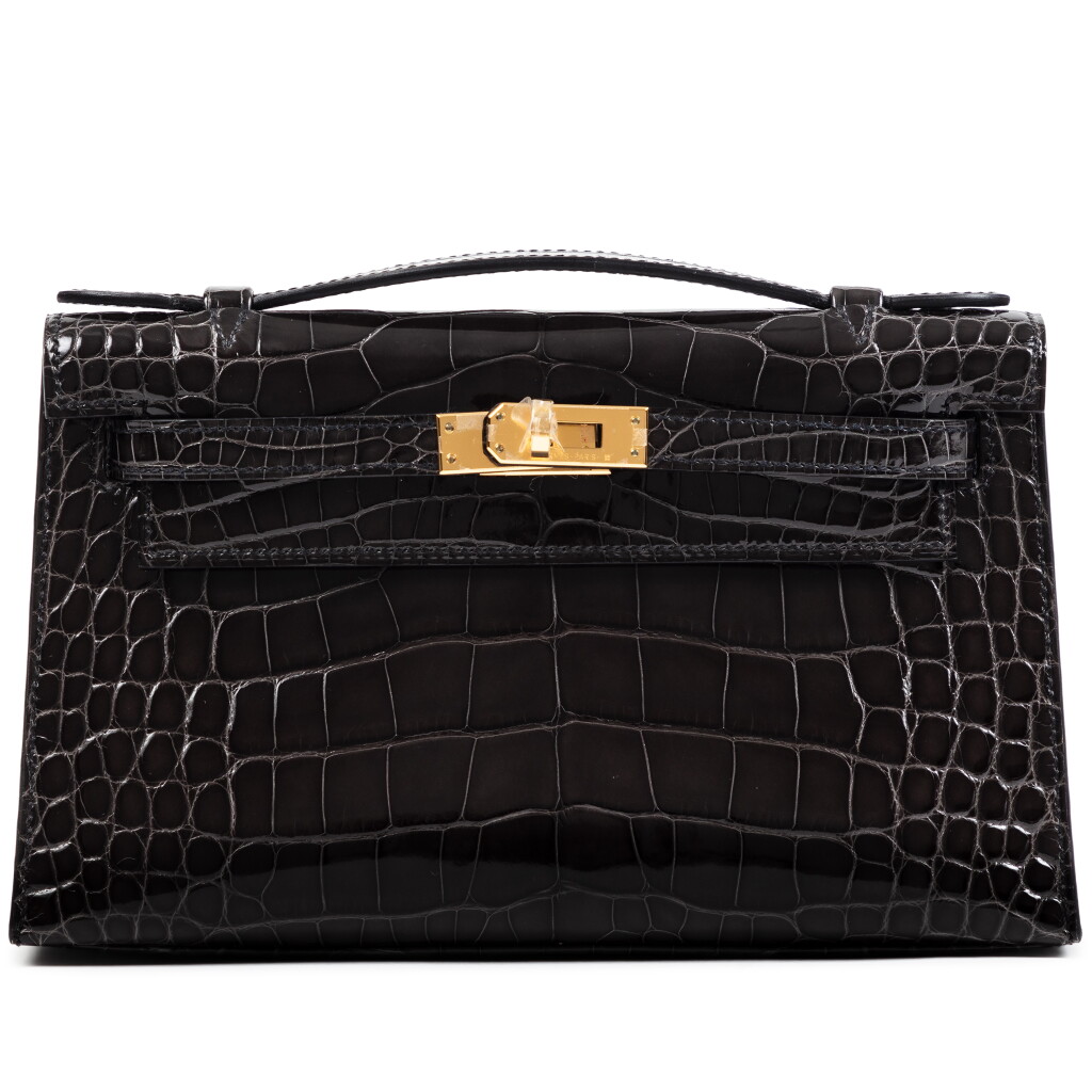View full screen - View 1 of Lot 323. Graphite Shiny Mississippiensis Alligator Kelly Pochette Gold Hardware, 2024.