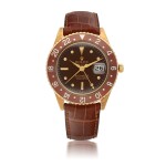 ROLEX | GMT-MASTER, REF 1675, YELLOW GOLD DUAL-TIME WRISTWATCH WITH DATE AND NO CROWN GUARDS CIRCA 1964