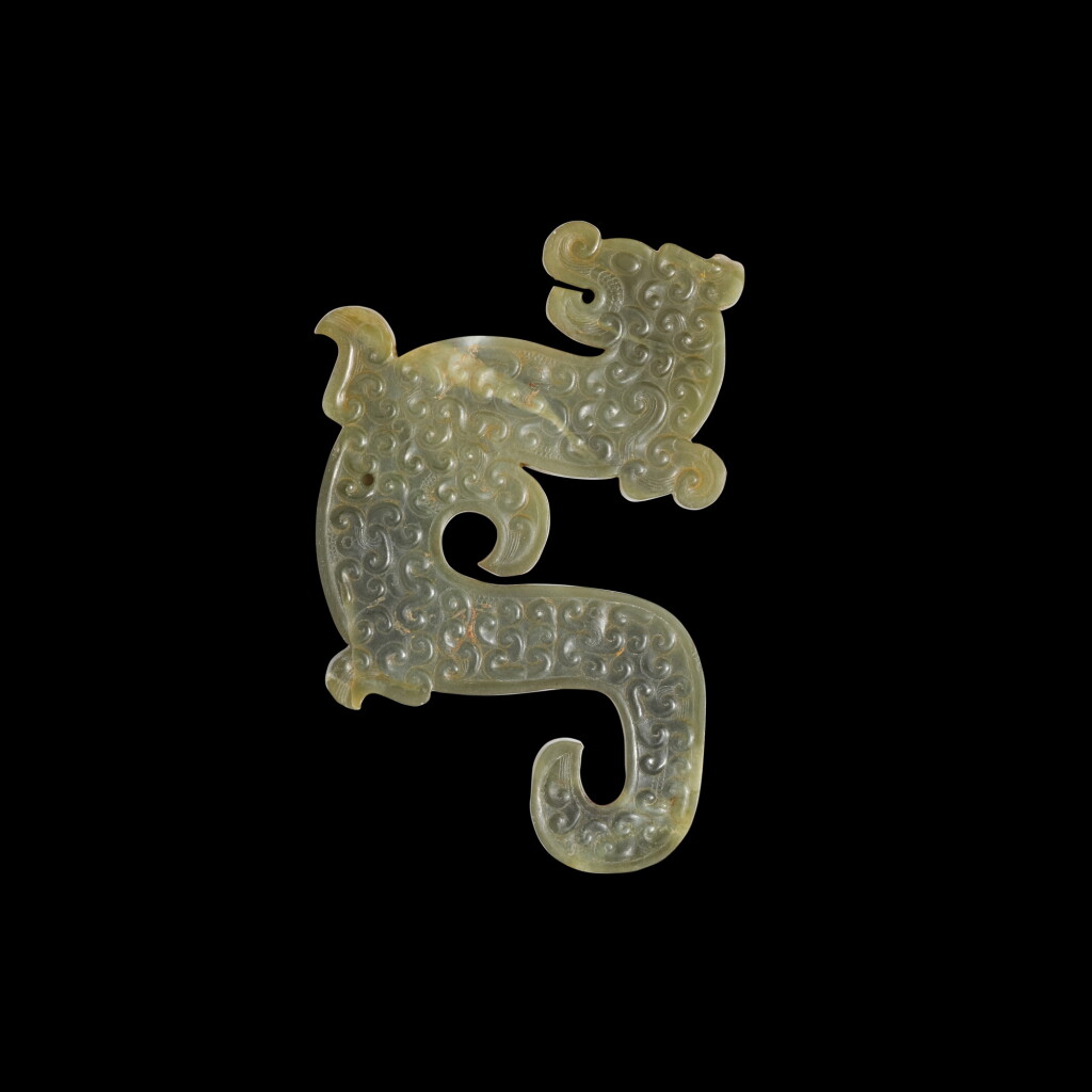 View full screen - View 1 of Lot 110. An archaic celadon jade dragon-form pendant, Eastern Zhou dynasty, late Spring and Autumn period.