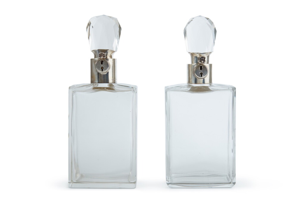 View full screen - View 1 of Lot 35. Two Matching English Silver-Mounted Cut-Glass Decanters, Hukin & Heath, Birmingham, 1923/1928.