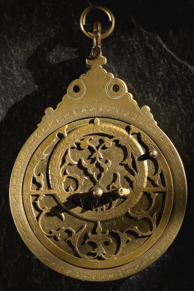 View full screen - View 1 of Lot 88. A PLANOSPHERIC BRASS ASTROLABE, SIGNED BY MUHAMMAD MUQIM, LAHORE, 17TH CENTURY.