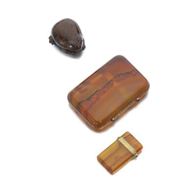 View full screen - View 1 of Lot 1106. Agate, sapphire and ruby cigarette case, a lighter box, and a hardstone and diamond toad, attributed to Fabergé, circa 1900.