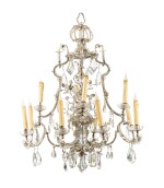 A 12-light gilt iron chandelier and a pair of 2-light sconces, Baguès, Paris, circa 1960 | Lustre à 12 lumières en bois doré et paire d'appliques en stuc doré à 2 lumières par Baguès, Paris, vers 1960