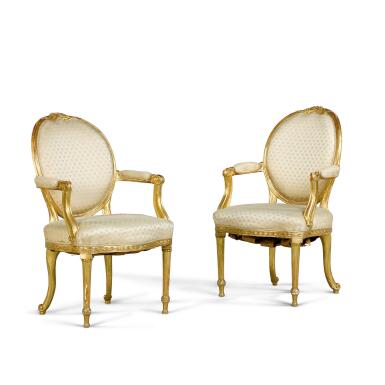 View full screen - View 1 of Lot 85. A pair of George III style carved giltwood armchairs, 19th century, after a design by Thomas Chippendale.
