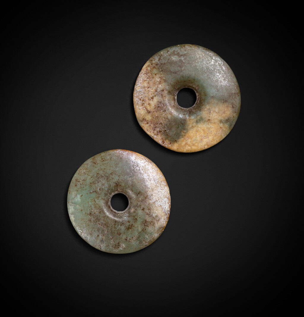 View full screen - View 1 of Lot 85. Two celadon jade discs, bi Neolithic period, Hongshan culture or earlier | 新石器時代 紅山文化或更早期青白玉璧兩件.