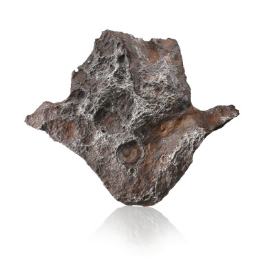 View full screen - View 1 of Lot 119. EXTRATERRESTRIAL HAMSA-SHAPED FLANGE — DRONINO METEORITE.