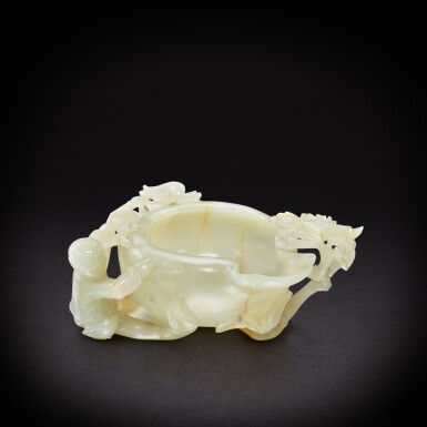 View full screen - View 1 of Lot 6921. A celadon jade 'boy' pouring vessel, Ming dynasty | 明 青玉雕榴開百子洗.