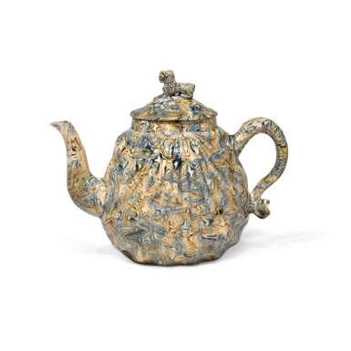View full screen - View 1 of Lot 31. A Staffordshire Sold-Agate Pecten-Shell Teapot and Cover, Circa 1750.