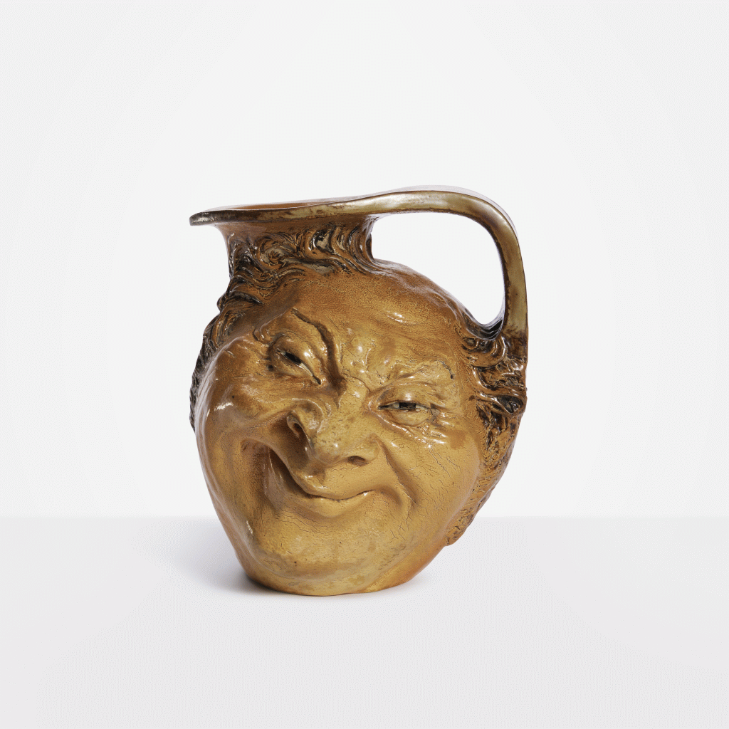 View full screen - View 1 of Lot 126. Double-Sided Face Jug.