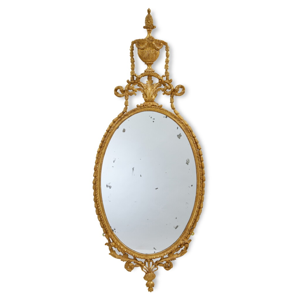 View full screen - View 1 of Lot 117. A George III Giltwood Oval Mirror, Circa 1775.