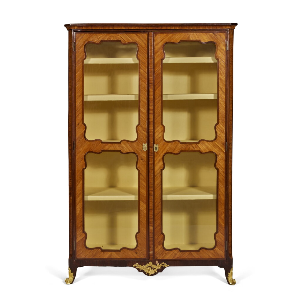View full screen - View 1 of Lot 48. A Louis XV Gilt-Bronze Mounted Kingwood and Amaranth Inlaid Vitrine, Circa 1765-70, Stamped P. DEFRICHE and JME.