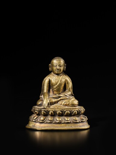 View full screen - View 1 of Lot 129. An inscribed copper alloy figure of Cohje Lorepa, Tibet, 14th century.