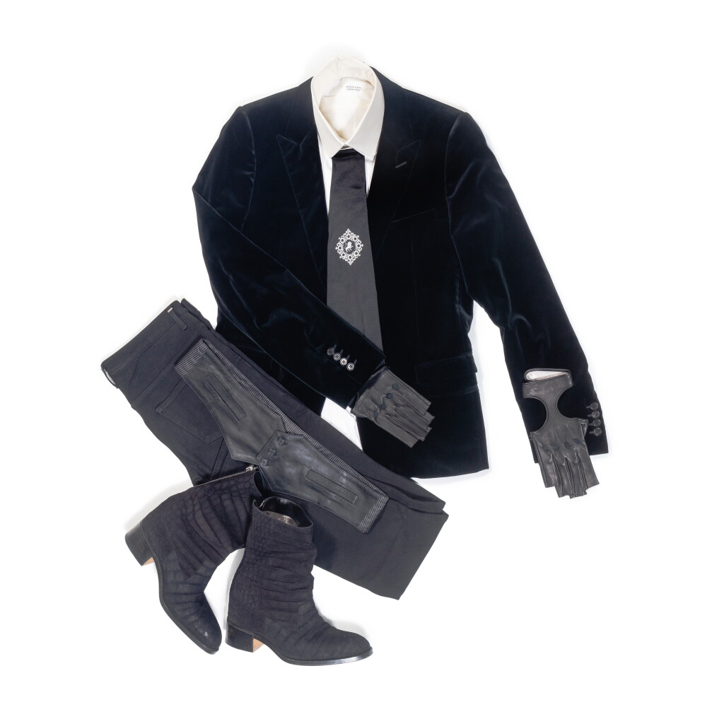 View full screen - View 1 of Lot 67. Karl Lagerfeld’s Total Look 2 "Le Kaiser": Dior, Black Velvet Blazer and Jeans; Chanel, Lion Embroidered Tie, Gloves; Hilditch & Key, KL Monogram Shirt and White Collar & Massaro, Boots.