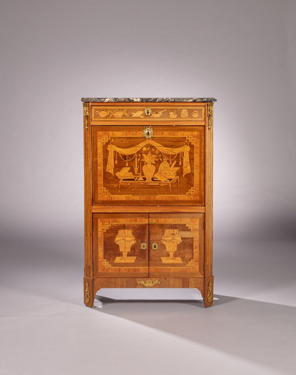 View full screen - View 1 of Lot 120. A Louis XVI tulipwood and amaranth marquetry and gilt-bronze mount secrétaire à abattant, stamped by Léonard Boudin | Secrétaire à abattant en marqueterie d'amarante et bois de rose, monture de bronze doré d'époque Louis XVI, estampille de Léonard Boudin.