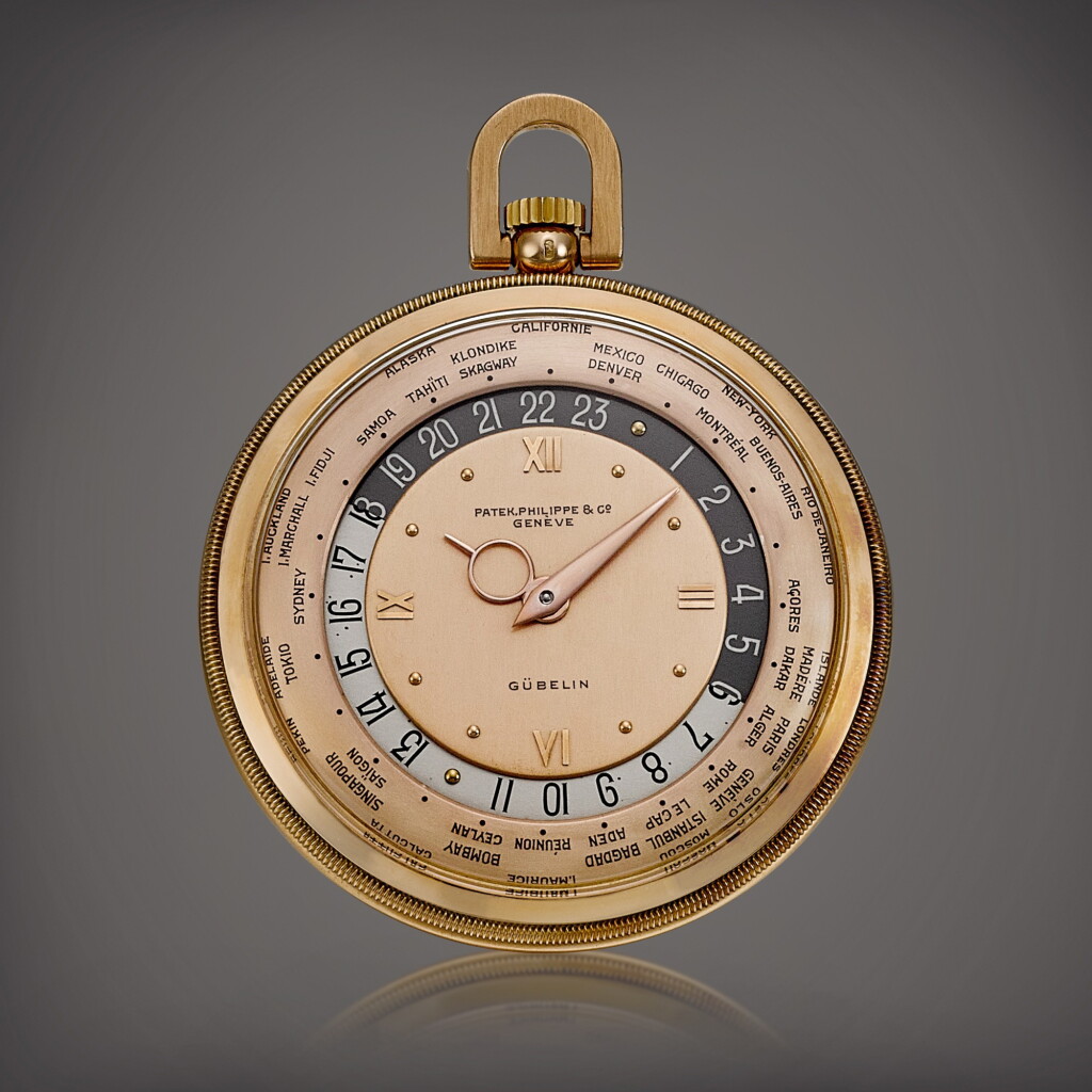 View full screen - View 1 of Lot 2005. Reference 605 | A pink gold worldtime openface watch with pink dial, Retailed by Gübelin, Made in 1946 | 百達翡麗 | 型號605 | 粉紅金世界時間懷錶,備粉紅色錶盤,由 Gübelin 發行,1946年製.
