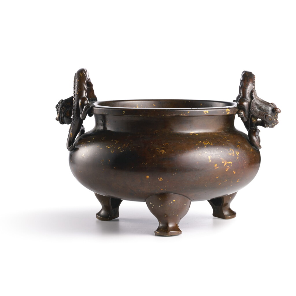 View full screen - View 1 of Lot 42. A LARGE GOLD-SPLASHED BRONZE 'DRAGON' TRIPOD CENSER, QING DYNASTY, KANGXI PERIOD | 清康熙 灑金銅雙龍耳三足爐.