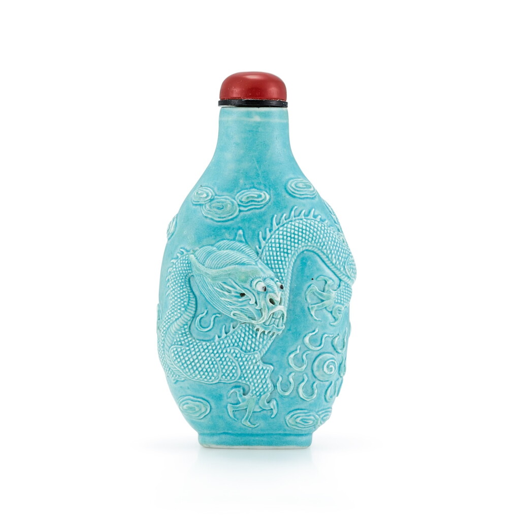 View full screen - View 1 of Lot 3010. A Turquoise-Glazed Carved 'Dragon' Porcelain Snuff Bottle By Wang Bingrong, Qing Dynasty, Jiaqing - Daoguang Period | 清嘉慶至道光 松綠彩浮雕雲龍逐珠圖鼻煙壺 《王炳榮作》款.