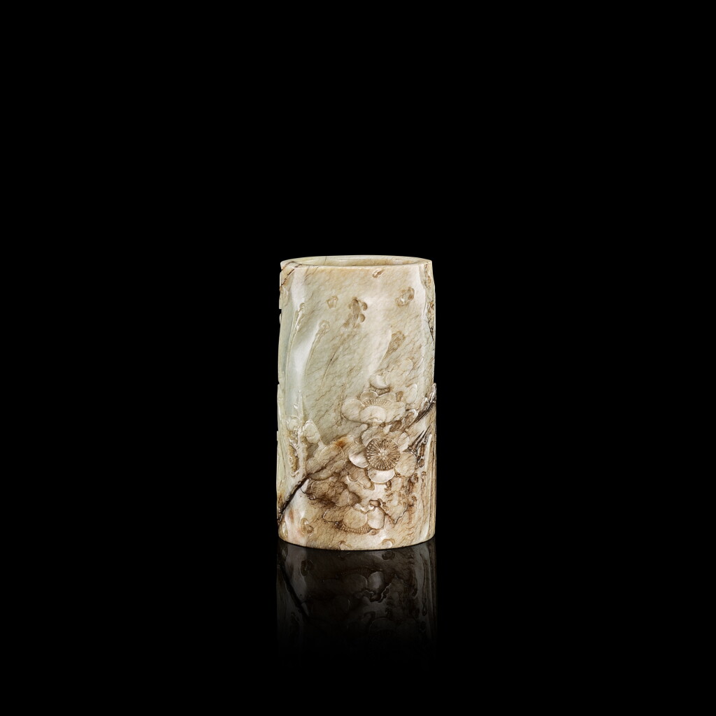 View full screen - View 1 of Lot 382. A small calcified jade 'prunus' cylindrical brushpot, 17th century 十七世紀 雞骨白玉雕梅紋筆筒.