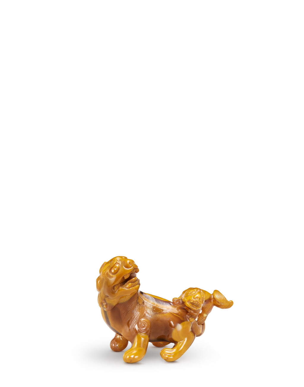 View full screen - View 1 of Lot 5086. A yellow agate 'lion' brushrest, Qing dynasty | 清 瑪瑙太獅少獅筆擱.
