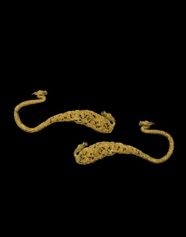 View full screen - View 1 of Lot 3663. A very rare pair of gilt-bronze ‘dragon’ ornaments, Qing dynasty, 18th century | 清十八世紀 鎏金銅鑄透雕雲龍紋帳鉤一對.