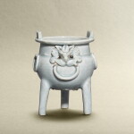 A qingbai-glazed 'mask' tripod incense burner, Southern Song - Yuan dynasty | 南宋至元 青白鋪首銜環鼎式爐