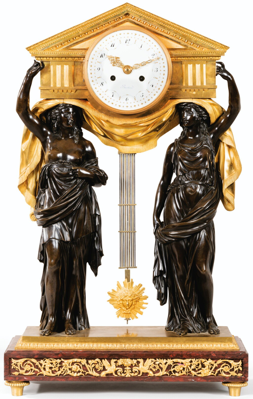 View full screen - View 1 of Lot 49. A LOUIS XVI GILT AND PATINATED BRONZE CLOCK, ATTRIBUTED TO FRANÇOIS RÉMOND, AFTER THE MODEL BY LOUIS-SIMON BOIZOT, THE DIAL AND THE MOVEMENT SIGNED BERTHOUD | PENDULE À FRONTON EN BRONZE PATINÉ ET DORÉ, DE LA FIN DE L'ÉPOQUE LOUIS XVI, ATTRIBUÉE À FRANÇOIS RÉMOND, LES FIGURES D'APRÈS LOUIS-SIMON BOIZOT, LE CADRAN ET LE MOUVEMENT SIGNÉS BERTHOUD.