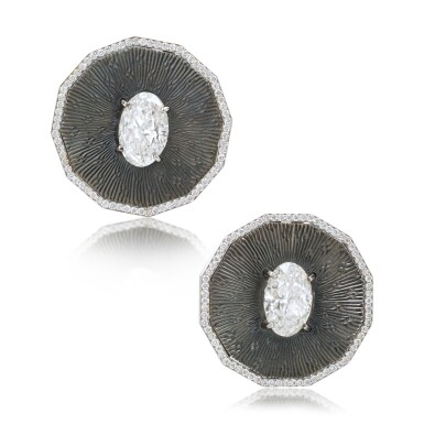 View full screen - View 1 of Lot 521. Pair of Bronze and Diamond Earrings.