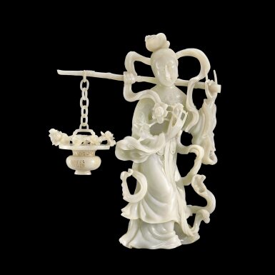 View full screen - View 1 of Lot 111. A large white jade figure of He Xiangu | 白玉荷仙姑立像.