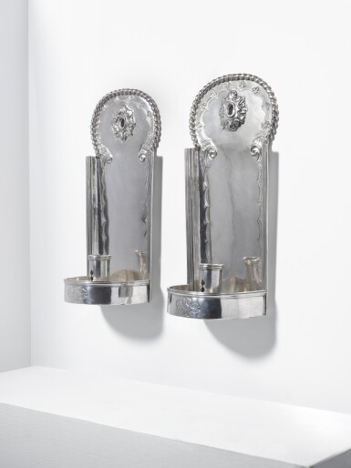 View full screen - View 1 of Lot 101. A pair of Louis XIV silver wall-lights, probably by R. Trabut, Avignon, late 17th- early 18th century.