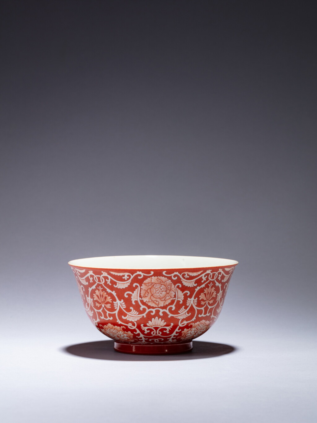 View full screen - View 1 of Lot 60. A coral-ground reverse-decorated 'lotus' bowl, Seal mark and period of Qianlong.