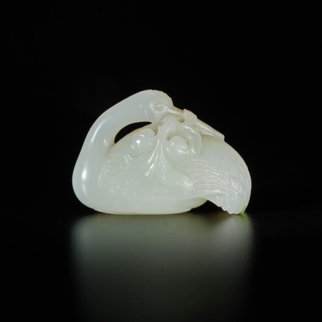 View full screen - View 1 of Lot 284. A white jade carving of a recumbent goose, Qing dynasty, Qianlong period | 清乾隆 白玉雕瑞鵝銜蓮把件.
