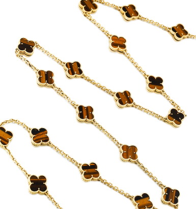 View full screen - View 1 of Lot 148. Van Cleef & Arpels | Sautoir œil-de-tigre, "Alhambra" | Tiger's eye sautoir, 'Alhambra'.