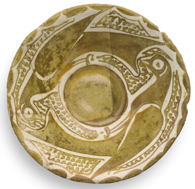 View full screen - View 1 of Lot 94. A SMALL ABBASID LUSTRE POTTERY BOWL DEPICTING TWO BIRDS, IRAQ, 10TH CENTURY.
