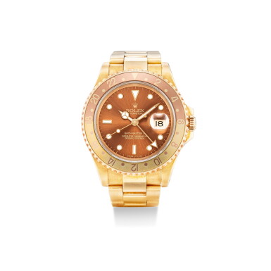 View full screen - View 1 of Lot 101. ROLEX | GMT-MASTER II, REFERENCE 16718, A YELLOW GOLD WRISTWATCH WITH DATE AND BRACELET, CIRCA 1993.
