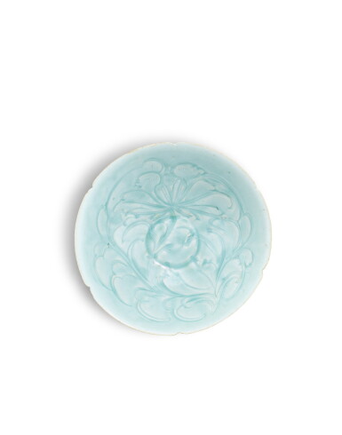 View full screen - View 1 of Lot 3701. A qingbai-glazed carved 'peony' bowl, Song dynasty | 宋 青白釉刻牡丹花大葵口盌.