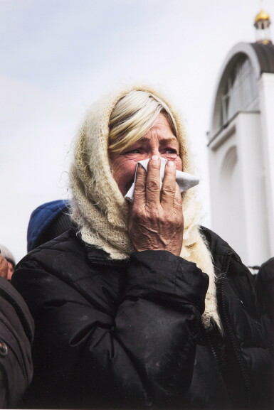 View full screen - View 1 of Lot 11. A resident of Bucha Watches as Authorities Excavate a Mass Grave, Bucha, Kyiv Region, 8 April 2022.