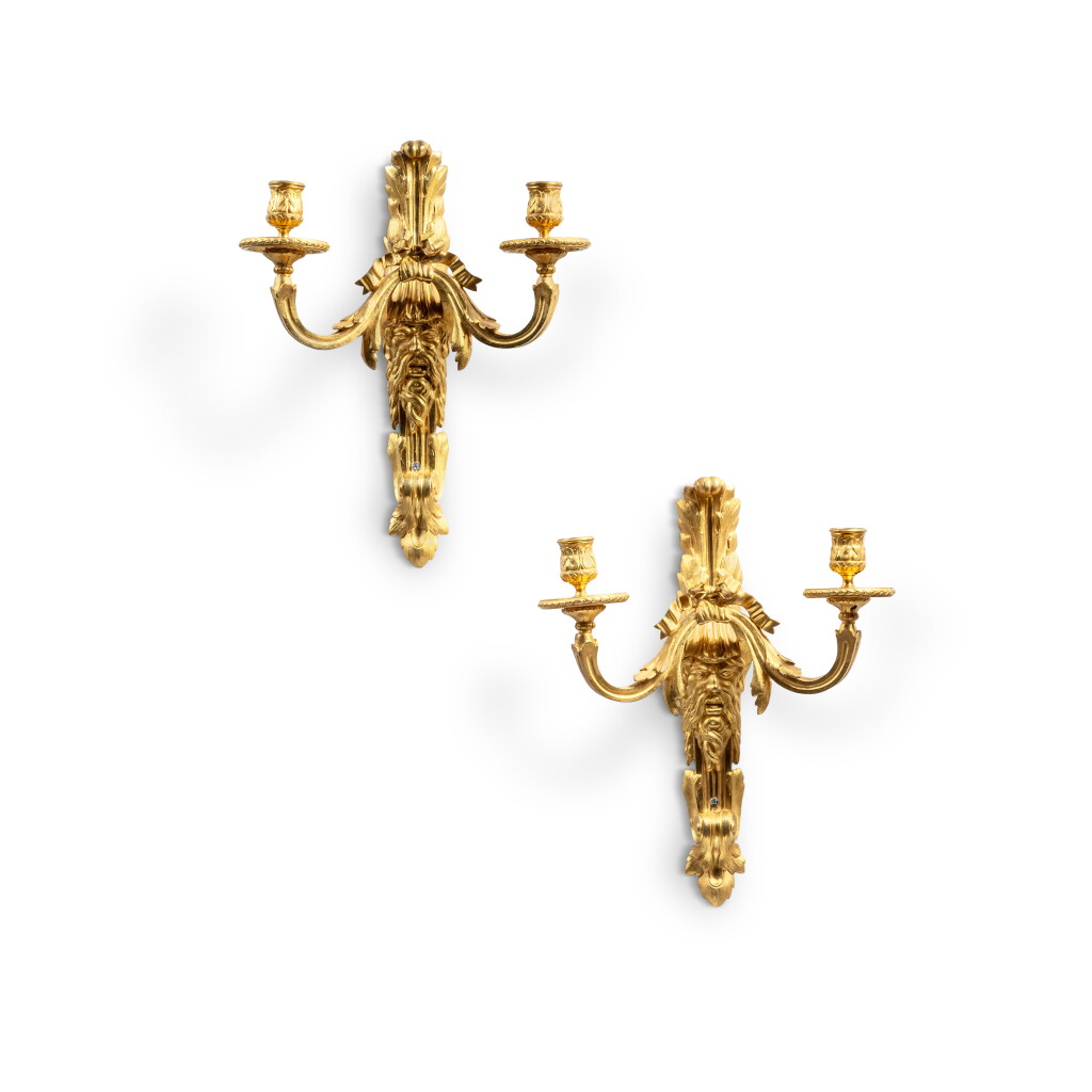 View full screen - View 1 of Lot 319. A pair of Louis XV style gilt-bronze two-light wall-lights, late 19th century.