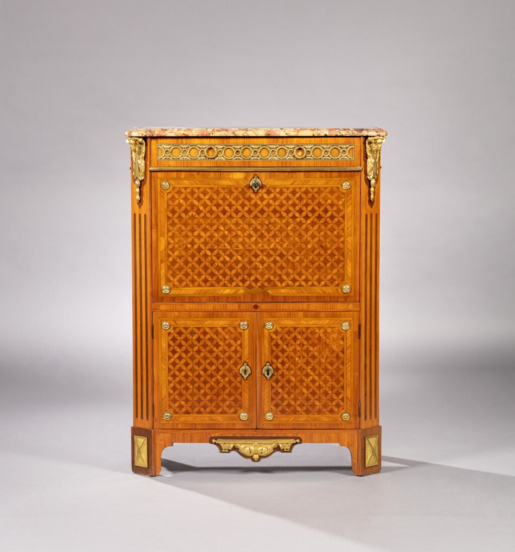 View full screen - View 1 of Lot 32. A Louis XVI amaranth, tulipwood and satinwood marquetry with gilt-bronze mounts secrétaire à abattant, stamped by Dautriche | Secrétaire à abattant en marqueterie d'amarante, de bois de rose et de satiné et monture de bronze doré, d'époque Louis XVI, vers 1780, estampille de Dautriche.